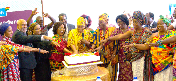 Lariba Zuweirra Abudu (with mic), Minister designate for Gender, Children and Social Protection, cutting the cake with Dr Charity Binka (4th from left), Chairperson, Interim Steering Committee, AWLN, and other dignitaries